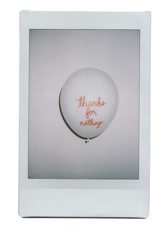 a white frame with an orange writing on the front and bottom that says, thank you for nothing