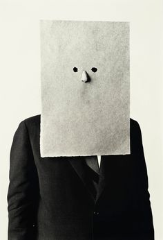 a man with a paper mask on his face