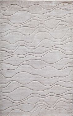 a white rug with wavy lines on it