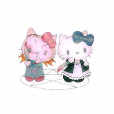 two hello kitty dolls standing next to each other