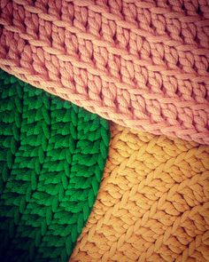 three different colors of knitted material are shown in this image, one is green and the other is yellow