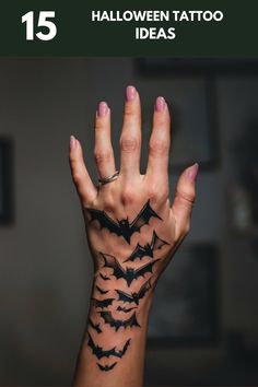 a woman's hand with bats on it and the text 15 halloween tattoo ideas