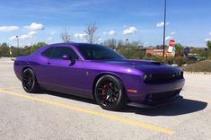 a purple car parked in a parking lot