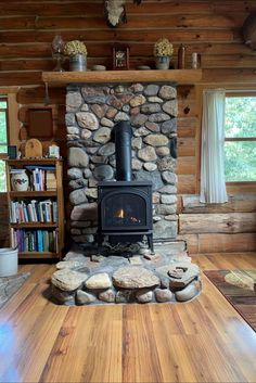 a wood burning stove in a log cabin