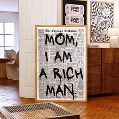 there is a sign that says mom, i am a rich man on the floor