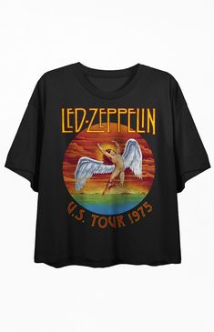 Online only! Rock out in style with this women's black Led Zeppelin crew neck short-sleeve crop top. The custom design features the iconic falling Icarus symbol in a vibrant rainbow circle, while bold orange letters spell out "Led Zeppelin, u.s. tour 1975." Made with combed ringspun cotton and lightweight polyester jersey, this crop top offers a comfortable and stylish fit. Embrace the spirit of Led Zeppelin with this high-quality crop top.


	Solid color tee
	Short sleeves
	Crew neckl Rainbow Circle, Led Zeppelin Shirt, Statement Tshirt, Concert Fits, Suit Up, Concert Tees, Cropped T Shirt, Movie T Shirts, Short Sleeve Cropped Top