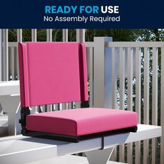 a pink chair sitting on top of a white table next to a wooden fence with text reading ready for use no assembly required