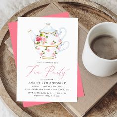 a cup of coffee next to a pink and white tea party card