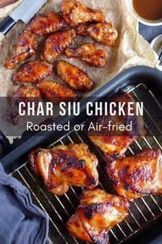 chicken wings on a grill with sauce in the background and text overlay that reads char siu chicken roasted or air fried