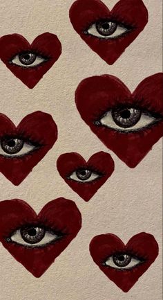 several hearts shaped like an eye with red lipstick on them, and the eyes are drawn in