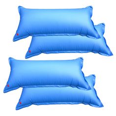 two blue pillows sitting next to each other