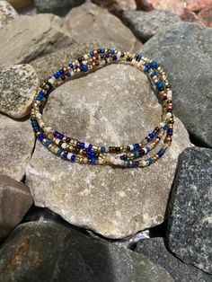 This stunning mix is the perfect transition from summer to autumn  Approx. 19.5" this beautiful array of beads can be wrapped twice around the ankle, 3 times around the wrist or simply slip over your head & wear as a necklace.  One size fits most. Stack with additional anklets/bracelets/necklaces to achieve different looks.  Made with a vibrant mix of 11/0, 8/0, Czech glass seed beads.  Made to order. Each one unique.  Each wrap will contain a different variation of colors in photo. No two exactly alike.  Add more bracelets to your stack here: etsy.com/listing/1038223316/ Add a set of matching stacking rings here: etsy.com/listing/829181666/ Wear with care:  Bracelets are made with stretch cord but please use care when handling. Stretching too far may cause breakage. Avoid the 5 S's to kee Summer To Autumn, Egyptian Inspired, Triple Wrap Bracelet, Head Wear, Stretchy Bracelets, Seed Bead Necklace, Anklet Bracelet, Cairo, Stacking Rings