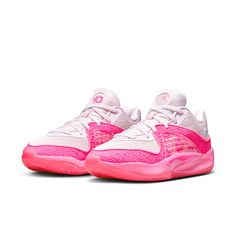 a pair of pink and white shoes on a white background