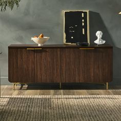 a modern sideboard with two bowls on it