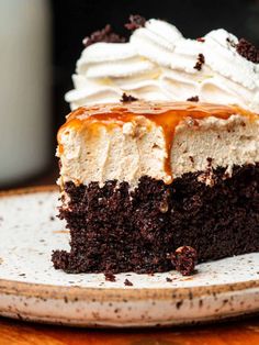 a piece of cake with whipped cream and caramel drizzle on top