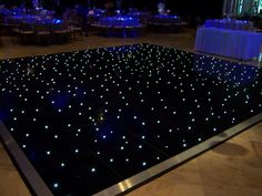 a dance floor with blue lights on it