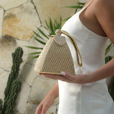 Elevate your fashion game with Verano Hill's exquisite gold bag ideas. This collection boasts must-have bags designed to add a touch of glamor to your wardrobe. Whether you're in search of bags for special occasions or versatile evening bags, we've got you covered. Explore the best bags that redefine elegance and style. Visit our website now to enhance your accessory collection and make a statement wherever you go. Gold Bag Outfit, Triangle Diamond, Bag Outfit