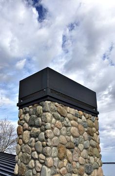 there is a large rock wall on top of the building