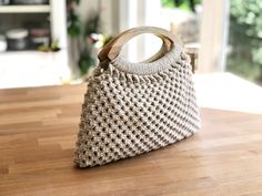 a purse sitting on top of a wooden table