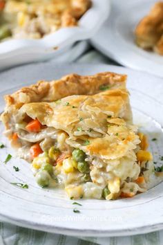 a slice of chicken pot pie on a white plate