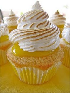 cupcakes with white frosting and yellow icing