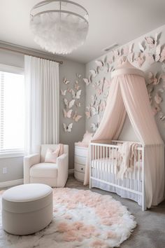 a baby's room with a canopy bed and pink butterflies on the wall behind it