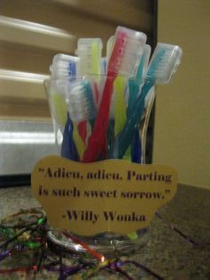 there are many toothbrushes in a cup on the counter with a sign that says, adin, adin, paring is such sweet sororrowy wonka