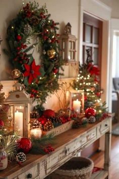 a table with christmas decorations and candles on it