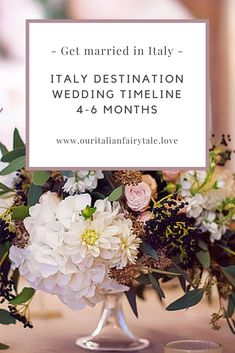 a vase filled with flowers on top of a table next to a sign that says get married in italy