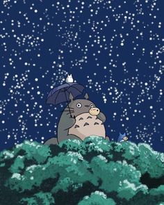 a person holding an umbrella standing in the snow with a totoro on it