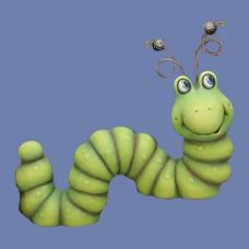 a very cute looking green caterpillar with big eyes