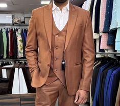 "This is a Classic 3 Piece Suit by Golden Attire crafted from high quality fabric and imported materials. Our products are handcrafted by experienced tailors who make sure the that the stitching is precise, lining is proper and the overall product is sturdy enough to not go out of shape for more than a few years. Also all our products have extra margins in their length, sleeves, sides so it's easily alterable if your size changes after some time. To see more available colours and designs in this collection, Check out the 'Classic Two Piece Suits' Section.  *This is a 3 piece set of a jacket and a trouser. *We also offer customization so we can provide you an even better fit if you massage us your measurements (in inches) of Chest, Stomach, Waist, Hip, Shoulder and Actual Height after order Brown Three-piece Suit For Wedding, Formal Brown Blazer For Wedding, Tailored Brown Sets For Groom, Brown Fitted Sets For Groom, Brown Tailored Tuxedo For Wedding, Brown Notch Lapel Sets For Groom, Brown Notch Lapel Sets For Grooms, Brown Wedding Tuxedo In Suiting Fabric, Brown Tuxedo Suit For Wedding