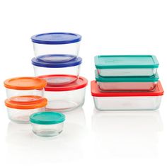 glass containers with lids and lids on white background