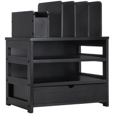 a black book shelf with drawers and shelves on it's sides, in front of a white background