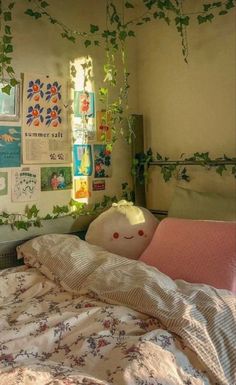 an unmade bed with plants growing on the wall