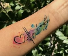 a person's arm with a tattoo that says strength and a heart on it