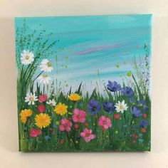 an acrylic painting of colorful flowers in a field