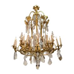 an antique chandelier with many crystal drops