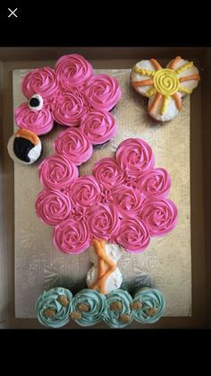 cupcakes are arranged in the shape of flowers