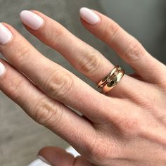 This ring is inspired by string lights. It's meant to be stacked between two other rings so that it looks like the diamonds are floating in the space between. The ring has a super fine piece of metal connecting the 5 diamonds across the top and a solid, rounded band on the bottom for comfortable wear. Modern Twist 14k Gold Round Cut Rings, 14k Gold Rings With Modern Twist And Round Cut, Rose Gold Stackable Rings With Diamond Cut Open Band, Double Band Yellow Gold Promise Rings, Stackable Diamond Rings With Double Band, Diamond Stackable Rings With Double Band, 14k Gold Rings With Tension Setting And Modern Twist, Stackable Double Band Diamond Promise Ring, Anniversary Stackable Rings With Single Diamond Open Band