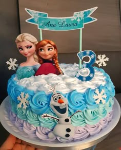 the birthday cake is decorated with frozen princess characters