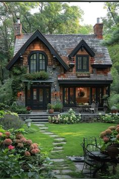 a house that is surrounded by trees and flowers