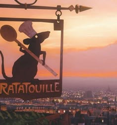 a ratatoulie sign hanging from the side of a building in front of a cityscape