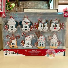 the mickey mouse christmas cookies are on display in their packaging box for $ 3 99