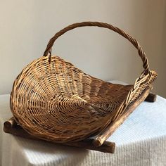 a wicker basket sitting on top of a table