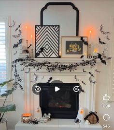 a fireplace decorated with halloween decorations and candles