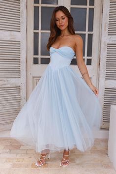 Length from bust to hem of size S: 116cm. Chest 35cm, Waist 30cm, across front only of size S. Midi dress. Lined. Model is a standard XS and is wearing size XS. True to size. Non-stretch. Tulle. Boning to bodice. Flowy skirt. Straps included. Inner grip. Zipper with hook eye closure. Cold hand wash only. Polyester/Nylon. Bring in the compliments with the Worthy Of Diamonds Strapless Tulle Midi Dress. Featuring boning to the bodice and a gorgeous flowy skirt. Style with heels for all-day fun. Tulle Midi Dress, Midi Dress Blue, Midi Dress Formal, Bridal Shower Dress, Shower Dresses, Skirt Style, Dress Satin, Dresses Backless, Flowy Skirt