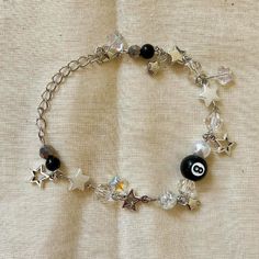 a bracelet with beads and charms on it