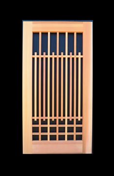 a wooden window with bars on the side and black wall behind it, in front of a black background