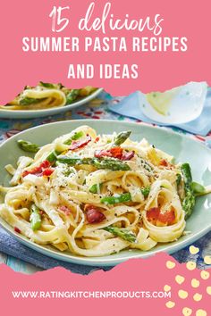 pasta with asparagus and tomatoes in a white bowl on top of a blue table cloth